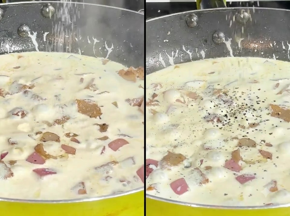 Sal y pimienta negra siendo esparcidas sobre una salsa de crema a fuego lento en un sartén.